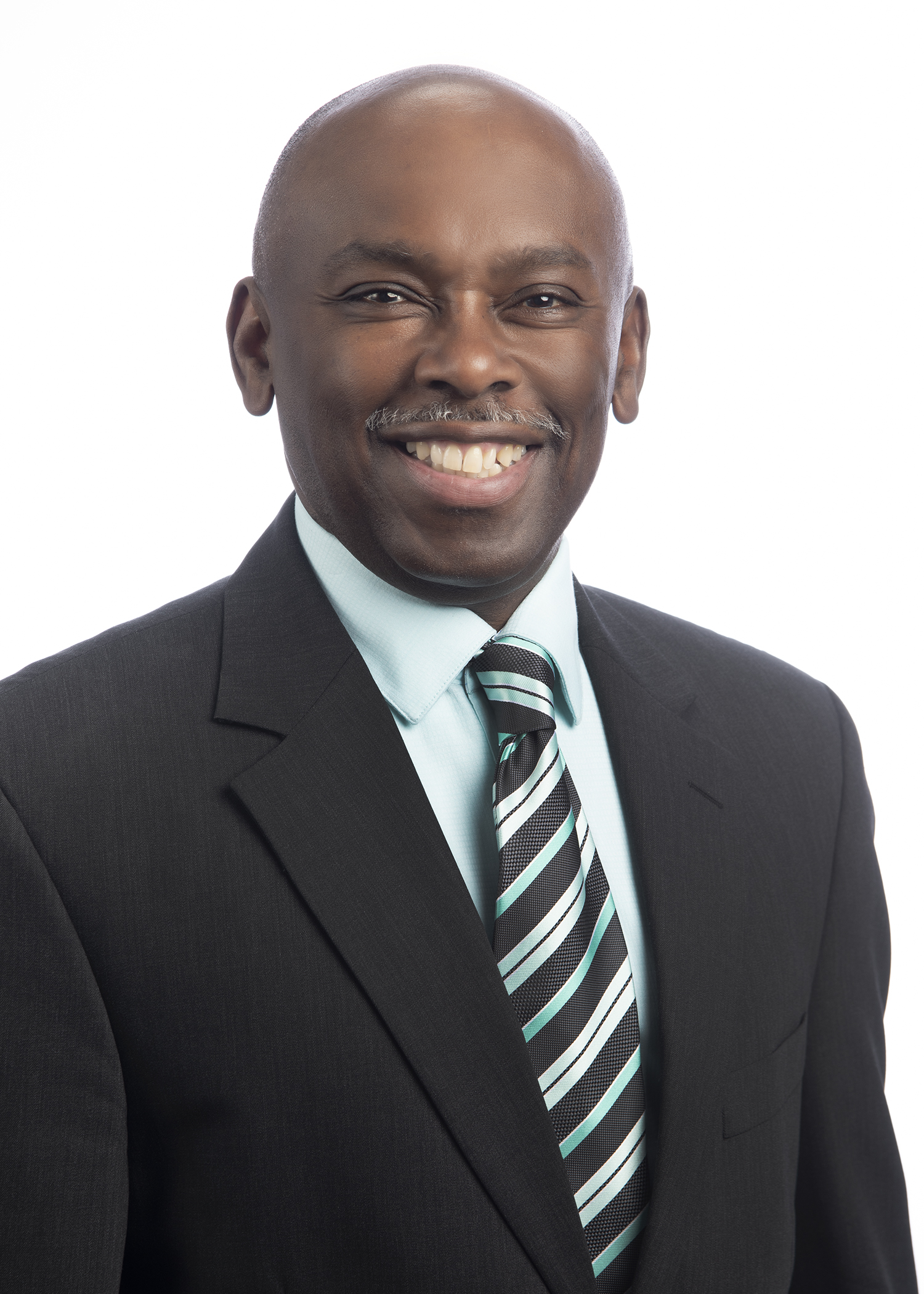 smiling black man in a suit and tie